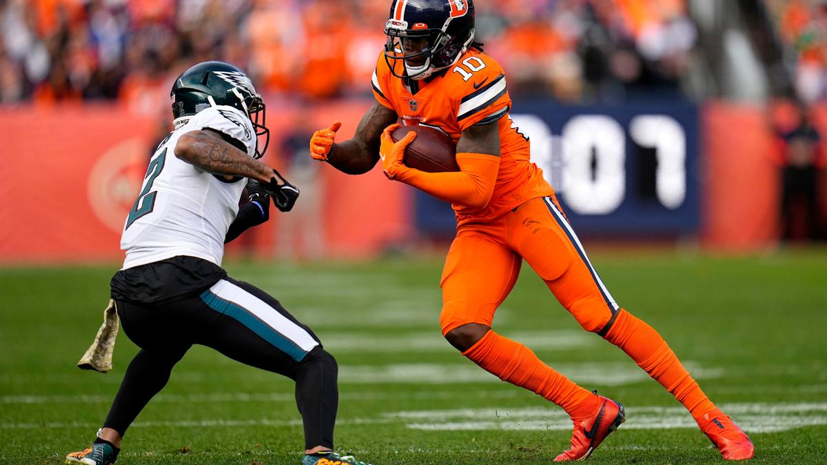 Denver Broncos wide receiver Jerry Jeudy (10) tries to elude Philadelphia Eagles cornerback Darius Slay (2) during the first half of an NFL football game, Sunday, Nov. 14, 2021, in Denver. (AP Photo/Jack Dempsey)