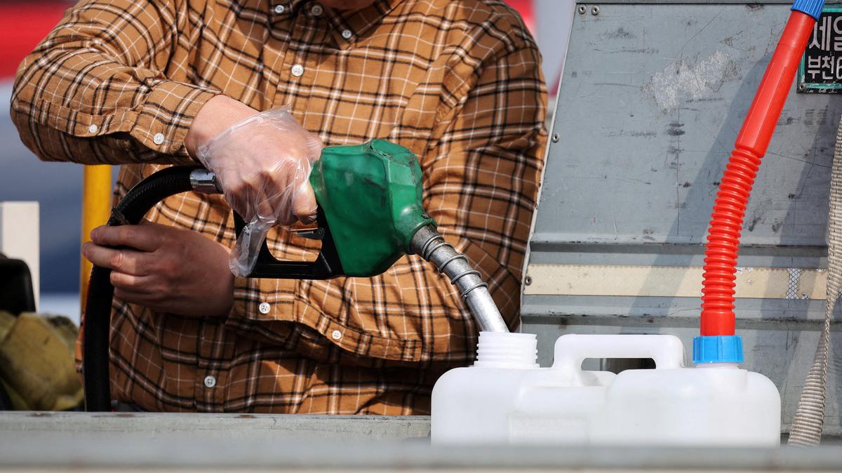 A man fills up a gas can at a gas station in Seoul, South Korea, March 9, 2026. REUTERS/Kim Hong-Ji