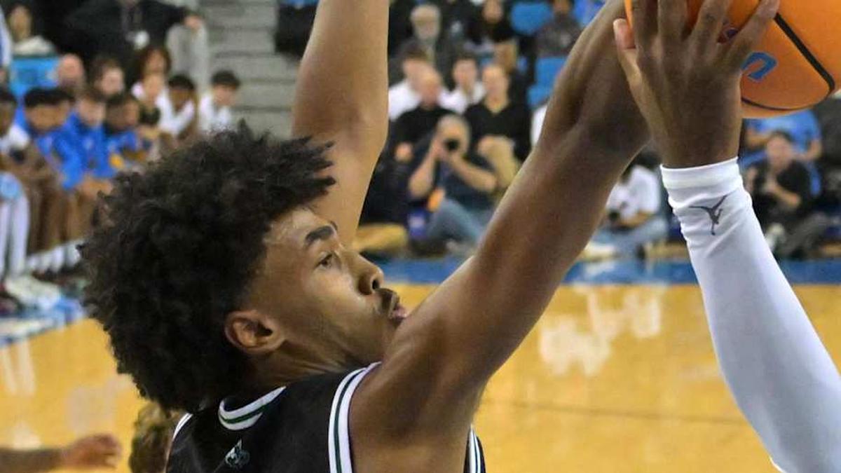  Dec 19, 2025; Los Angeles, California, USA; UCLA Bruins guard Eric Dailey Jr. (3) is defended by Cal Poly Mustangs guard Hamad Mousa (10) as he goes up for a basket during the first half at Pauley Pavilion presented by Wescom Financial. Mandatory Credit: Jayne Kamin-Oncea-Imagn Images | Jayne Kamin-Oncea-Imagn Images 