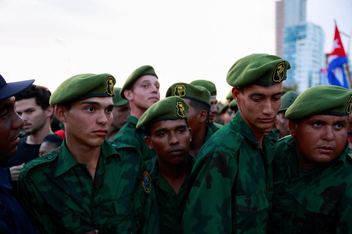 Members of the Revolutionary Armed Forces gather ahead of a pro-government rally called by Cuban authorities to protest U.S. policies toward the island, including the indictment of former Cuban president Raul Castro, in Havana, Cuba, May 22, 2026. REUTERS/Norlys Perez