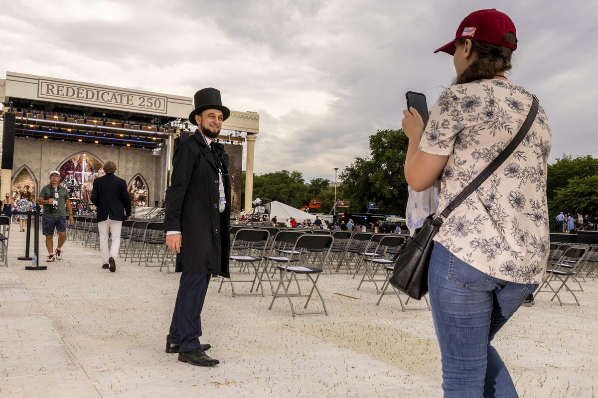 An attendee dressed as former President Abraham Lincoln at Rededicate 250: A National Jubilee of Prayer, Praise & Thanksgiving, in Washington on Sunday, May 17, 2026. Thousands of people gathered on the National Mall on Sunday for a daylong rally blending Christian prayer and political fervor, a gathering President Donald Trump had touted as an opportunity to "rededicate America as one nation under God." (Alex Kent/The New York Times)
