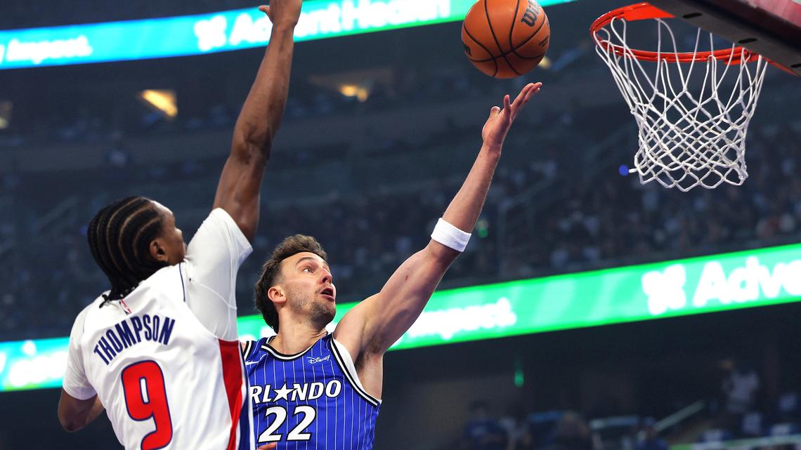 The Orlando Magic’s Franz Wagner (22) makes a layup past Detroit Pistons’ Ausar Thompson (9) during Game 4 of the first round of the NBA Playoffs at the Kia Center in Orlando, Fla., Monday, April 27, 2026. (Joe Burbank/Orlando Sentinel/TNS)