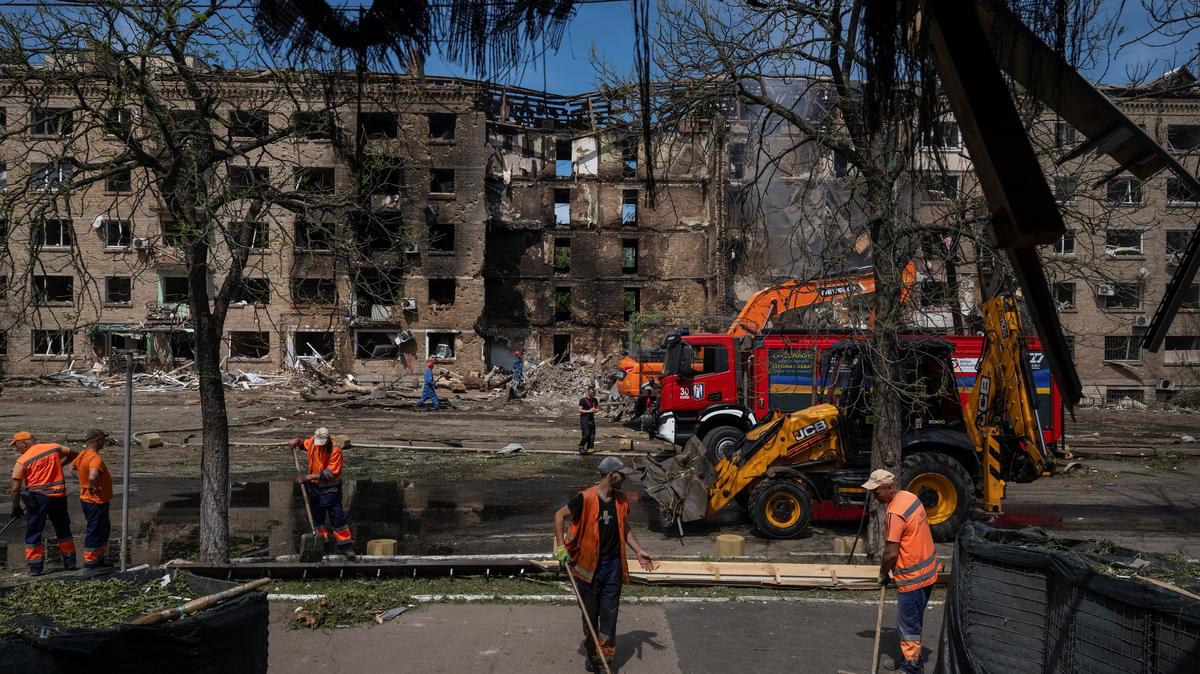 Communal workers clean an area at the site of a Russian missile and drone strike, amid Russia's attack on Ukraine, in Kyiv, Ukraine May 24, 2026. REUTERS/Viacheslav Ratynskyi