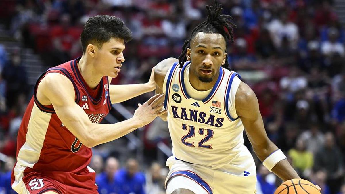  Mar 22, 2026; San Diego, CA, USA; Kansas Jayhawks guard Darryn Peterson (22) controls the ball against St. John's Red Storm guard Dylan Darling (0) in the first half during a second round game of the men's 2026 NCAA Tournament at Viejas Arena. | Denis Poroy-Imagn Images 