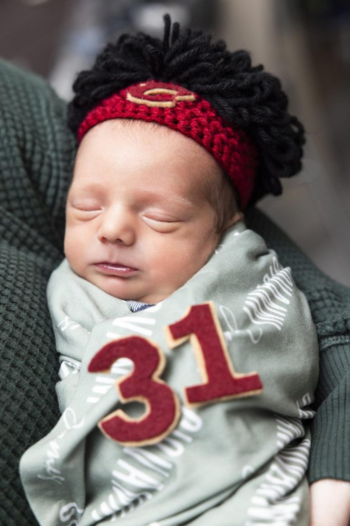  A baby wears a wig and the number of Cleveland Cavs star Jarrett Allen. (Cleveland Clinic Children's via SWNS) 
