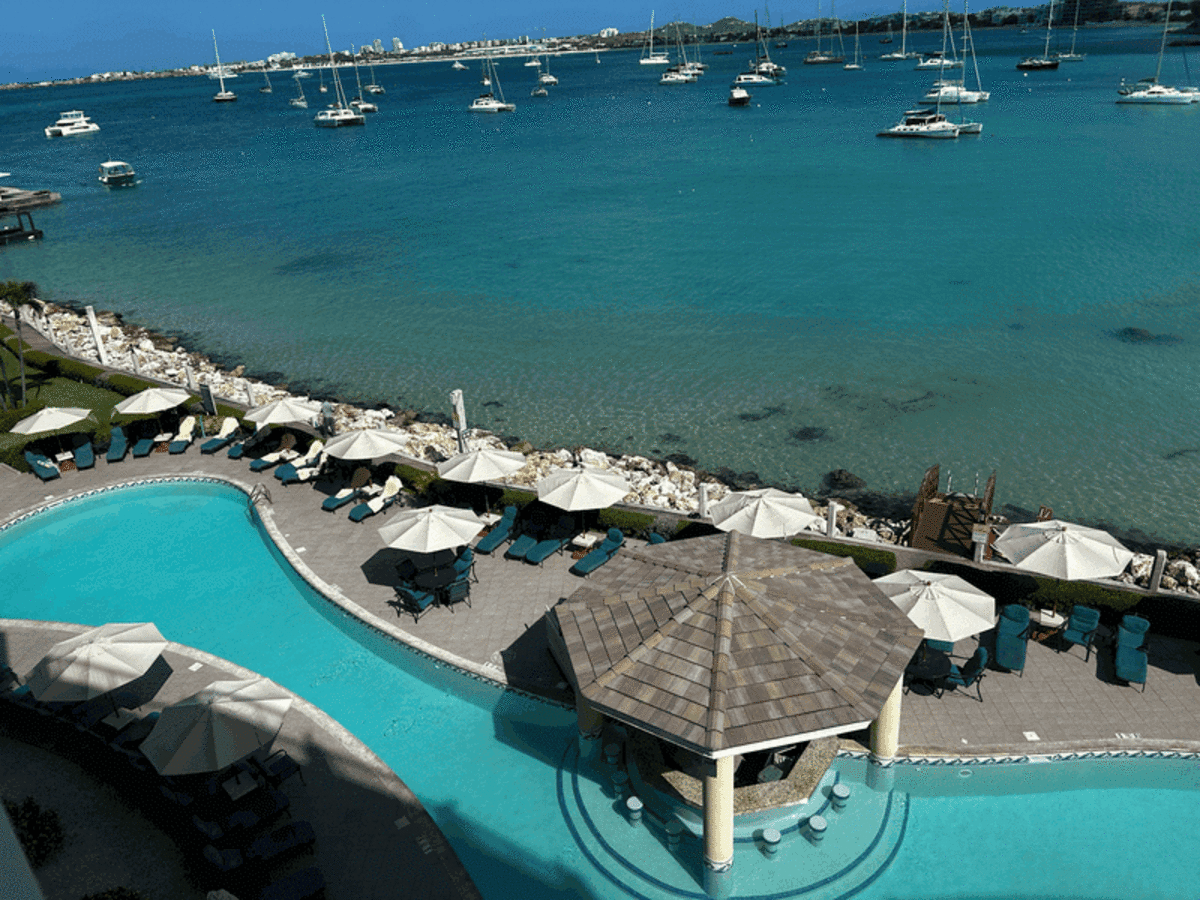  The stunning waterfront pool and marina at Simpson Bay Resort, showing why its central location makes it the ideal home base for island adventures. Photo credit: Lauren Harby 