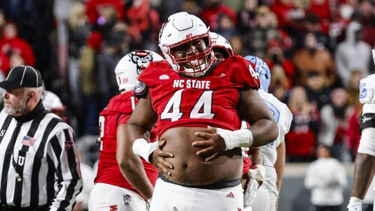  Nov 29, 2025; Raleigh, North Carolina, USA; NC State Wolfpack defensive tackle Brandon Cleveland (44) reacts to his tackle during the first half of the game against North Carolina Tar Heels at Carter-Finley Stadium. Mandatory Credit: Jaylynn Nash-Imagn Images | Jaylynn Nash-Imagn Images 