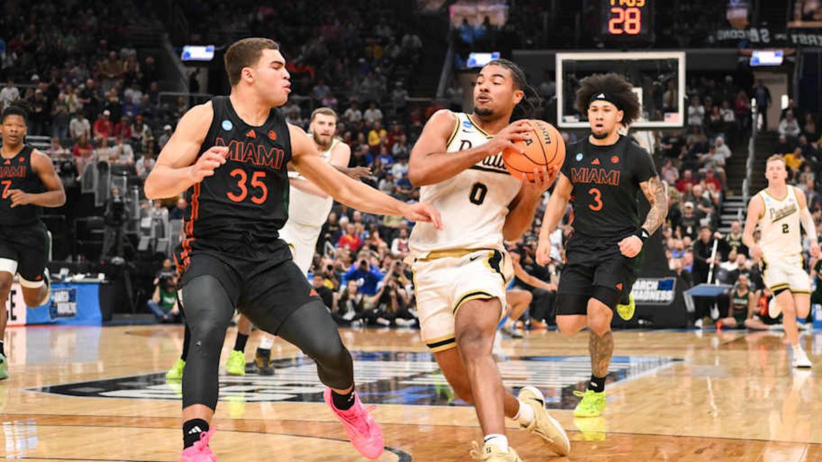  Mar 22, 2026; St. Louis, MO, USA; Purdue Boilermakers guard C.J. Cox (0) drives against Miami Hurricanes guard Dante Allen (35) during the second half during a second round game of the men's 2026 NCAA Tournament at Enterprise Center. Mandatory Credit: Jeff Curry-Imagn Images | Jeff Curry-Imagn Images 