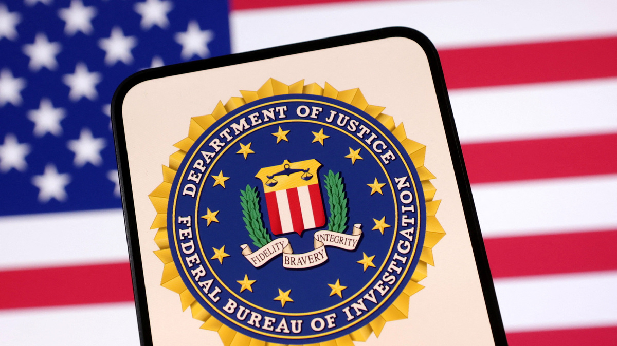 United States Department of Justice logo and U.S. flag are seen in this illustration taken April 23, 2025. REUTERS/Dado Ruvic/Illustration