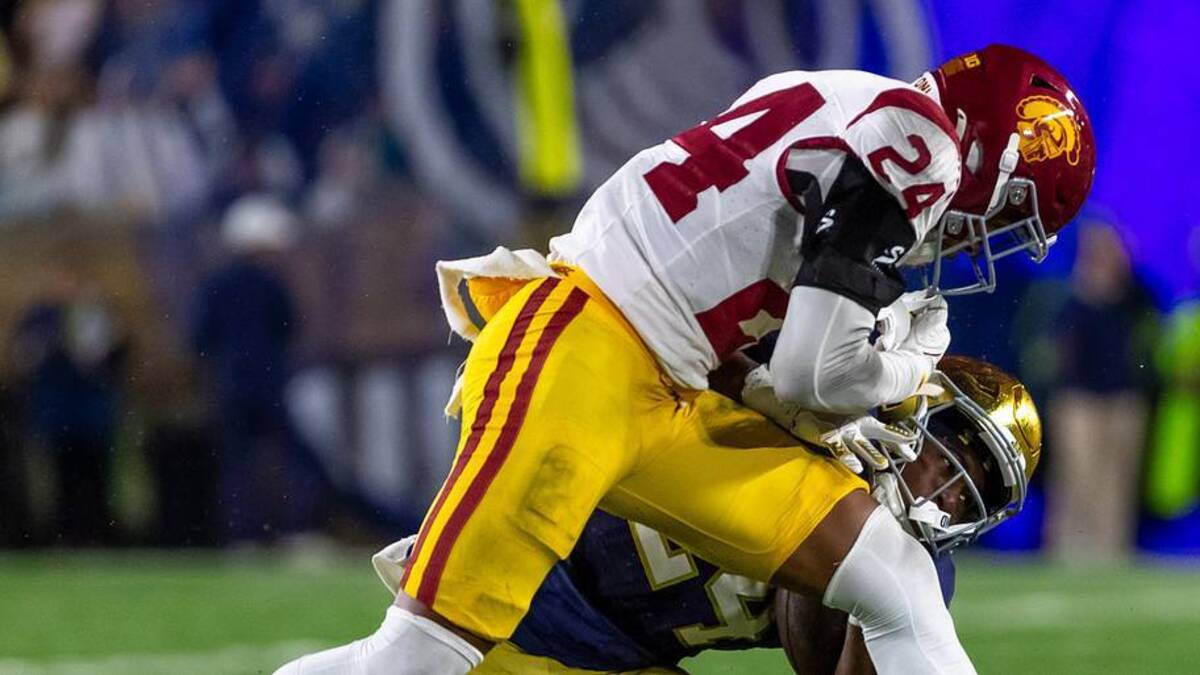  Oct 18, 2025; South Bend, Indiana, USA; Southern California Trojans safety Christian Pierce (24) hits Notre Dame Fighting Irish running back Jadarian Price (24) during the second half at Notre Dame Stadium. Mandatory Credit: Michael Caterina-Imagn Images | IMAGN IMAGES via Reuters Connect 