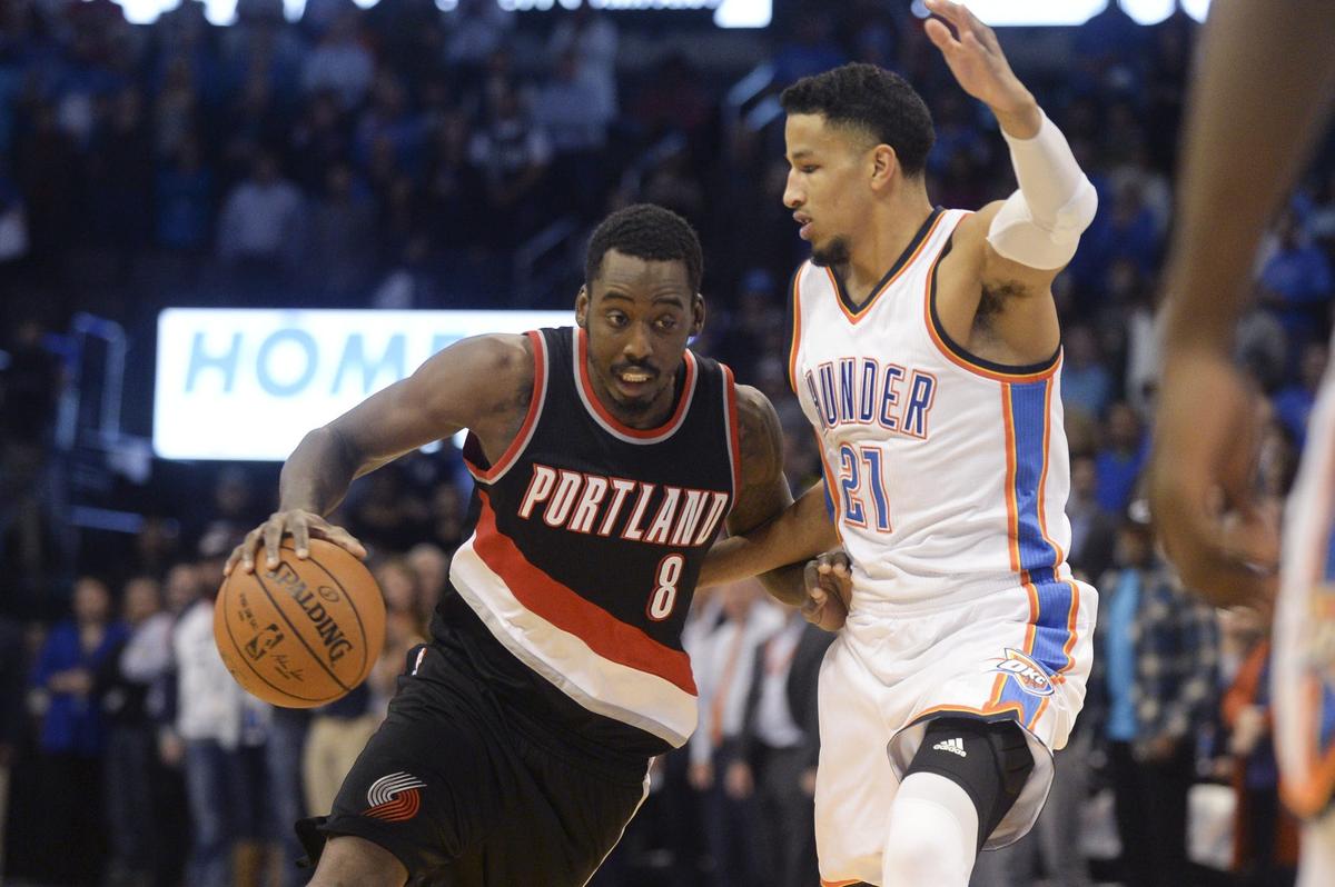 Dec 16, 2015; Oklahoma City, OK, USA; Portland Trail Blazers forward Al-Farouq Aminu (8) drives to the basket in front of Oklahoma City Thunder guard Andre Roberson (21) during the first quarter at Chesapeake Energy Arena. Mandatory Credit: Mark D. Smith-USA TODAY Sports