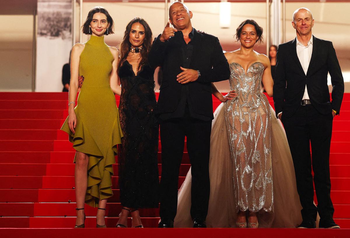 Jordana Brewster, Michelle Rodriguez, Neal H. Moritz, Meadow Walker and Vin Diesel pose on the red carpet for the screening of the film "The Fast and the Furious" presented as part of Special Screenings to celebrate the 25th anniversary of "The Fast and the Furious" franchise at the 79th Cannes Film Festival in Cannes, France, May 14, 2026. REUTERS/Gonzalo Fuentes