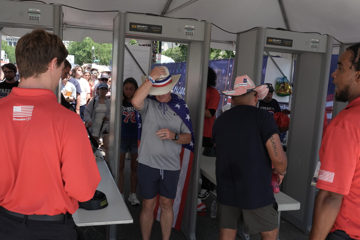 People pass through security near the National Archives in Washington, amid celebrations of the 250th anniversary of the United States, July 4, 2026. America celebrates the 250th anniversary of its independence today, with people from one end of the country to the other marking the milestone with fireworks, parades and concerts. (Alex Kent/The New York Times)