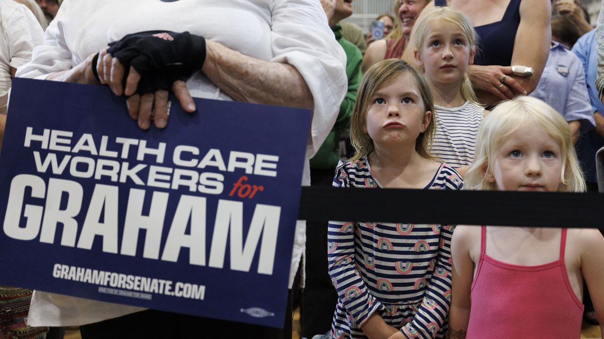 Young girls listen to Democratic U.S. Senate candidate Graham Platner speaking at his Primary Election event on June 9, 2026, in Blue Hill, Maine. Platner is the presumptive Democratic nominee and will face incumbent Sen. Collins (R-ME) for Maine's U.S. Senate seat in the general election. (CJ Gunther/Getty Images/TNS)