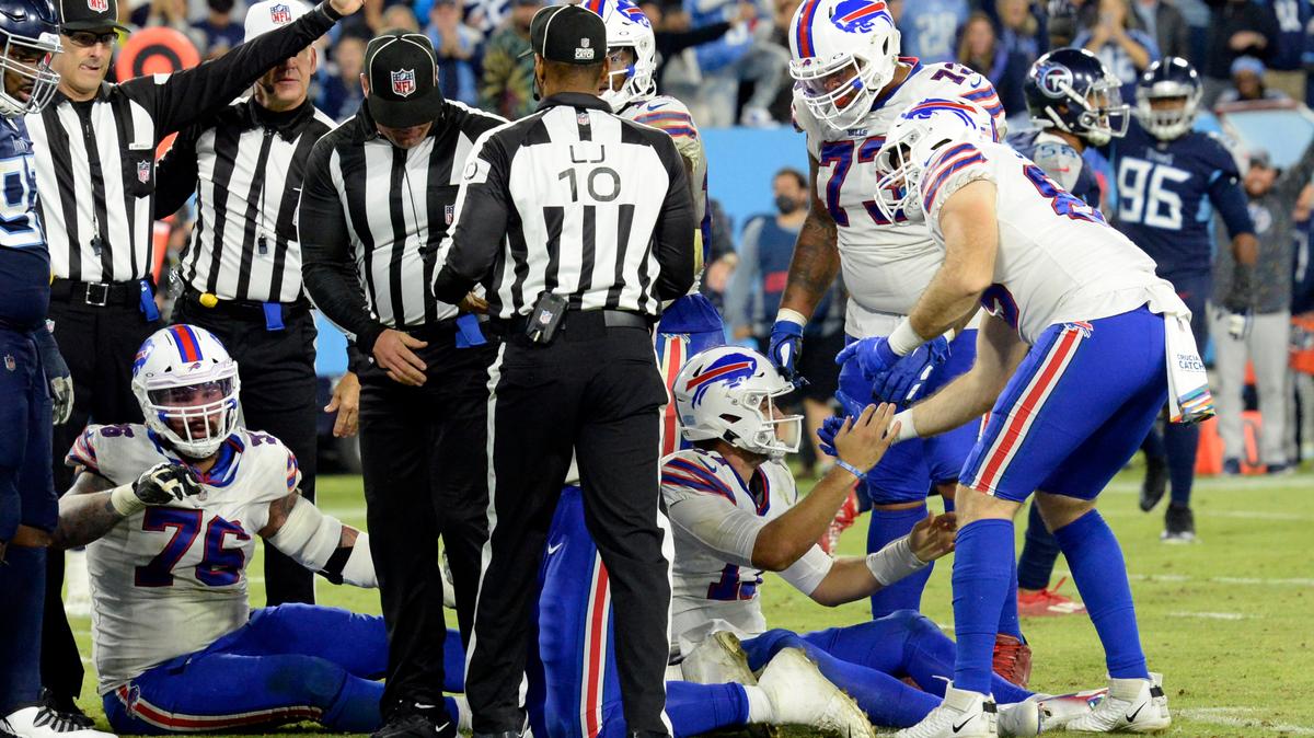 Buffalo Bills quarterback Josh Allen (17) is helped up after his run was ruled short of the distance needed for a first down on the Bills’ final play of the game against the Tennessee Titans in an NFL football game Monday, Oct. 18, 2021, in Nashville, Tenn. The Titans won 34-31. (AP Photo/Mark Zaleski)