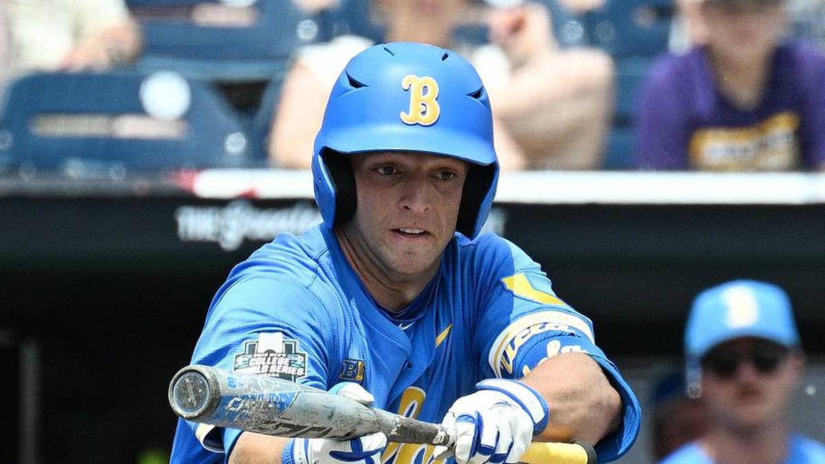  Jun 14, 2025; Omaha, Neb, USA; UCLA Bruins shortstop Roch Cholowsky (1) bunts in a run against the Murray State Racers during the fourth inning at Charles Schwab Field. Mandatory Credit: Steven Branscombe-Imagn Images | Steven Branscombe-Imagn Images 