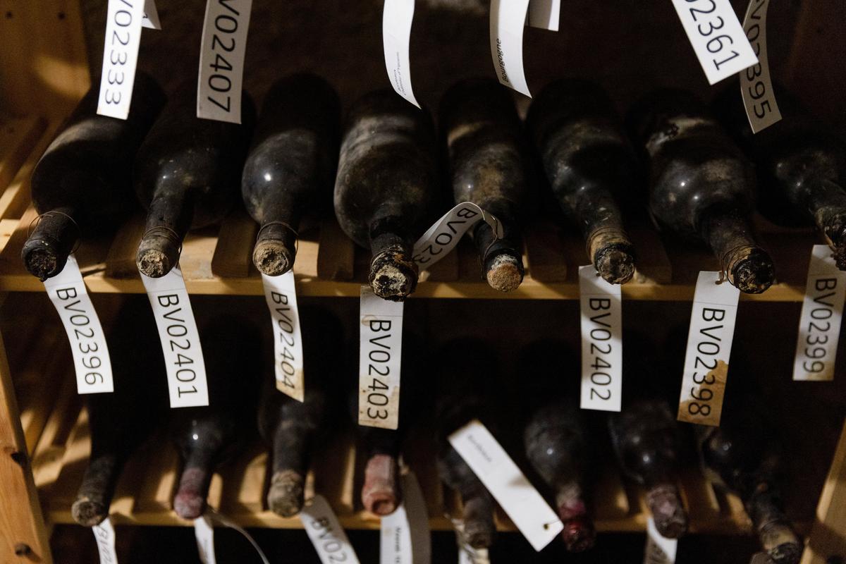 Bottles of 19th-century wine are kept on shelves in a cellar of Becov castle, as State Castle and Chateau of Becov nad Teplou, where the restored Chateau d'Yquem wine collection, discovered in 1985 and linked to the Beaufort-Spotin family, is presented to the public following a complex restoration with French experts in Becov nad Teplou, Czech Republic, June 1, 2026 REUTERS/Eva Korinkov