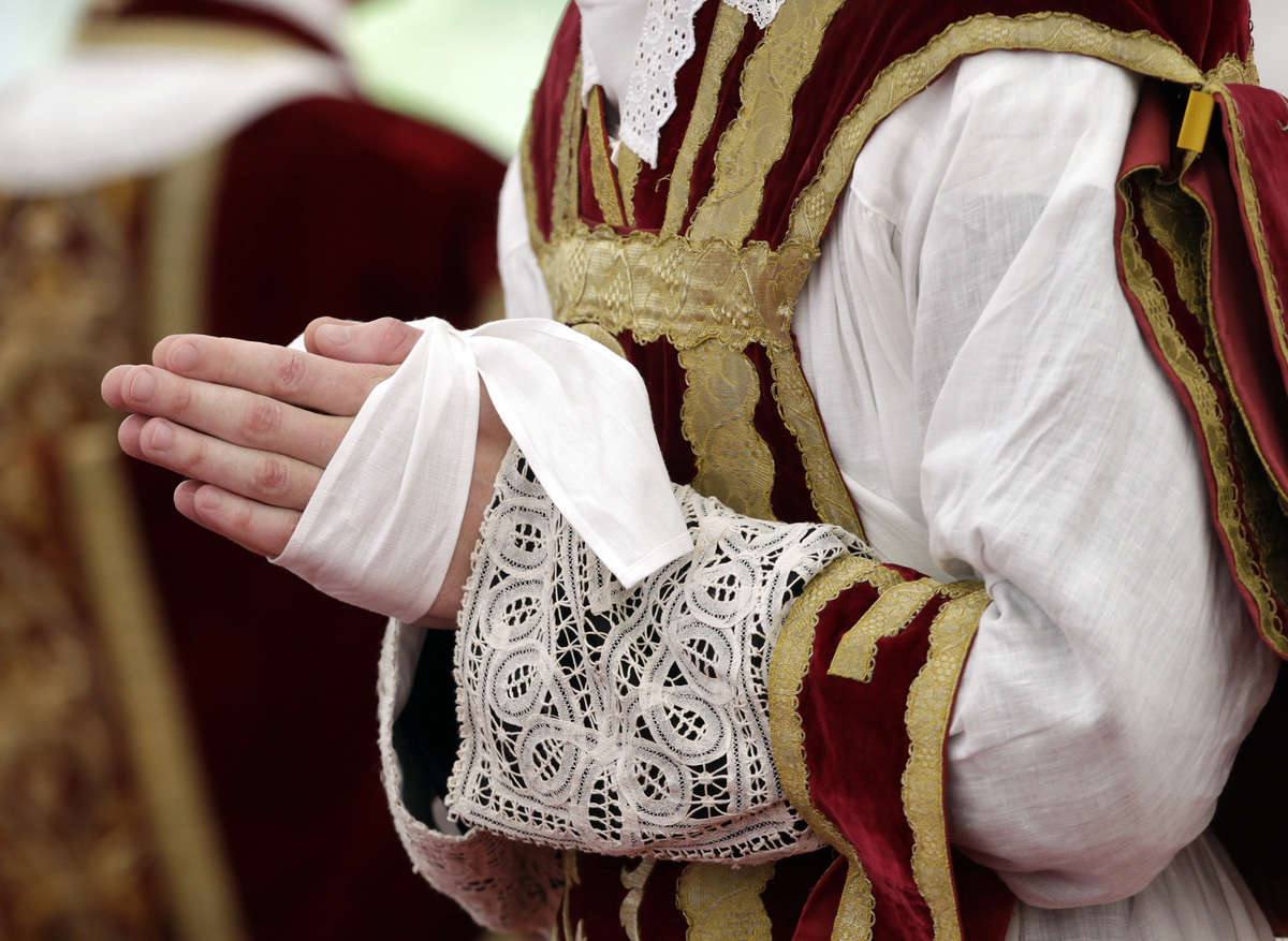 FILE PHOTO: The hands of a newly ordained priest are pictured during a ceremony in Econe June 29, 2012. REUTERS/Denis Balibouse/File Photo
