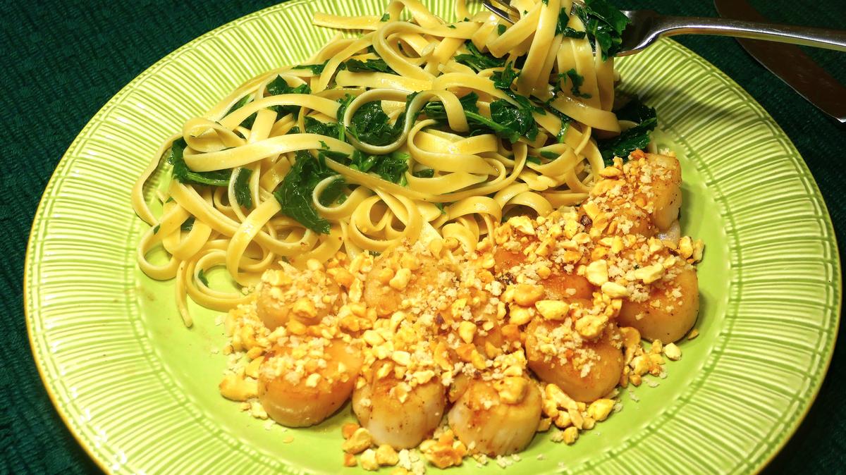 Peanut crusted sea scallops with fettuccine. (Linda Gassenheimer/TNS)
