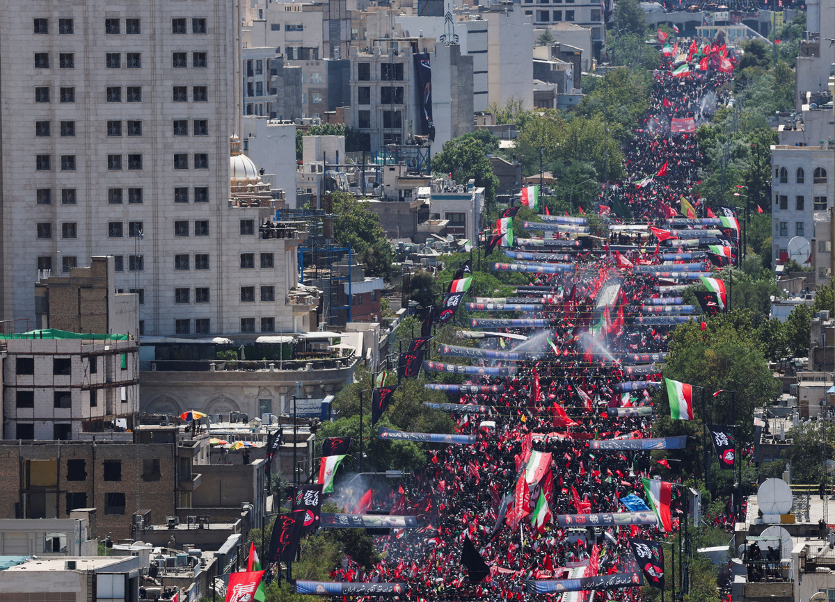 Mourners gather on the day of the burial of Iran's late Supreme Leader Ayatollah Ali Khamenei, who was killed on February 28 in Israeli and U.S. airstrikes, in Mashhad, Iran, July 9, 2026. REUTERS/Mohammed Salem.