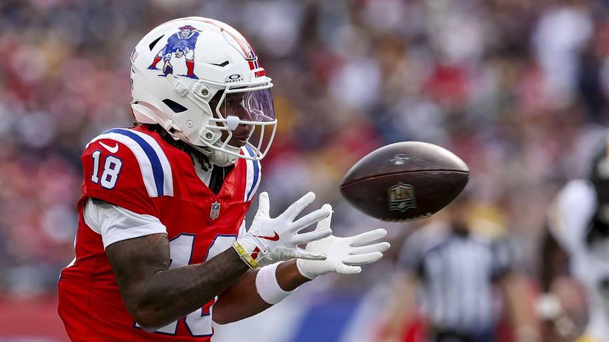  Sep 21, 2025; Foxborough, Massachusetts, USA; New England Patriots wide receiver Kyle Williams (18) completes a pass during the third quarter at Gillette Stadium. Mandatory Credit: Paul Rutherford-Imagn Images | Paul Rutherford-Imagn Images 