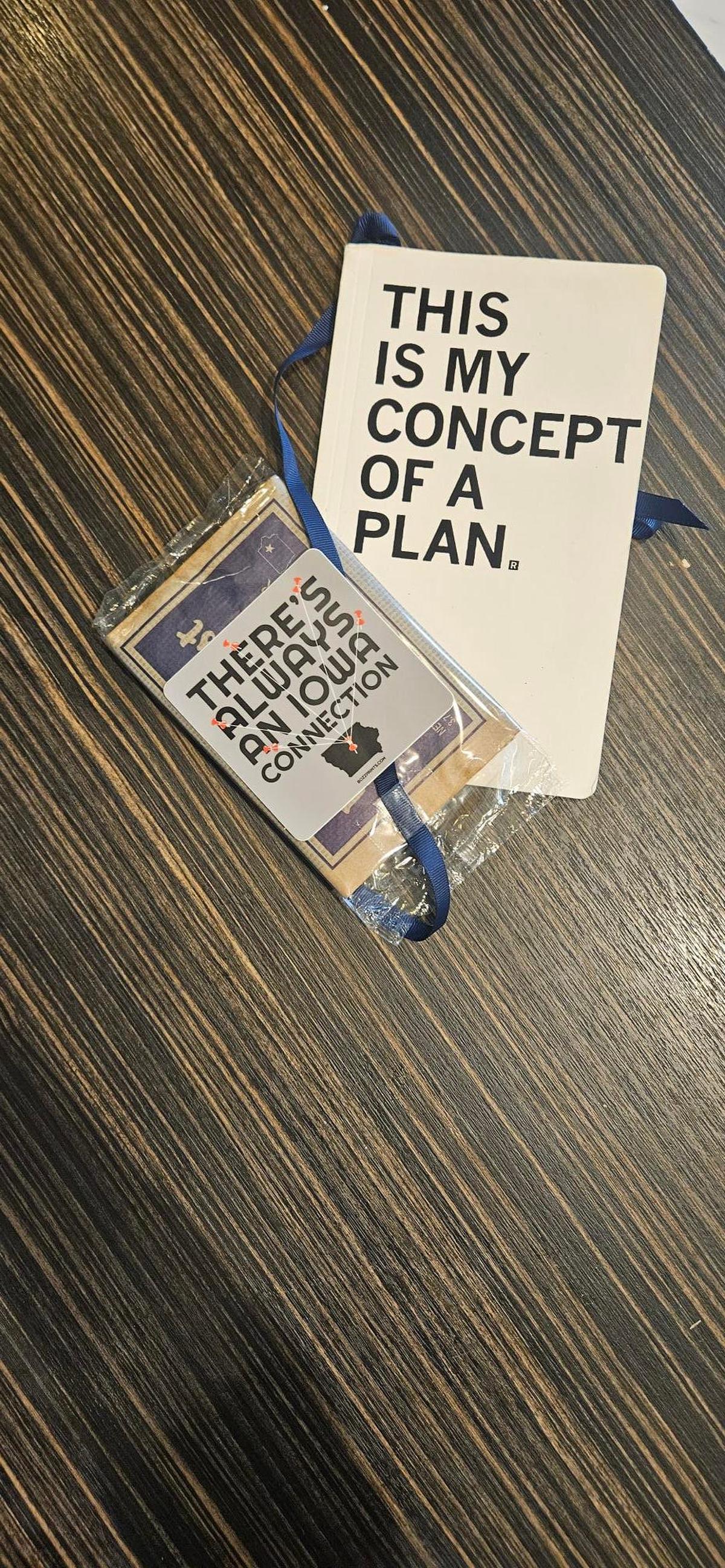 Iowa Democrats making a pitch to restore the caucuses' first-in-the-nation status passed out notebooks printed by Iowa business Raygun to Democratic National Committee rules and bylaws committee members at their May meeting in Washington, D.C.