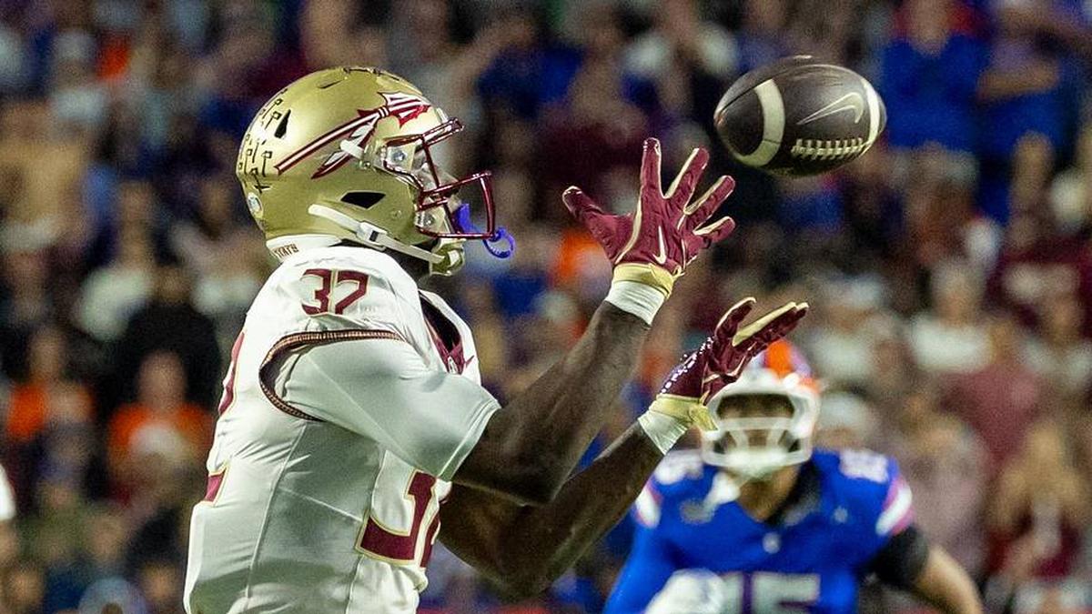  Nov 29, 2025; Gainesville, Florida, USA; Florida State Seminoles running back Ousmane Kromah (32) drops the ball during the second quarter against the Florida Gators at Ben Hill Griffin Stadium. Mandatory Credit: Bob Kupbens-Imagn Images | Bob Kupbens-Imagn Images 