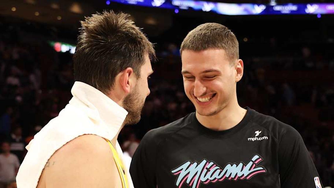  Mar 19, 2026; Miami, Florida, USA; Miami Heat forward Nikola Jovic (5) laughing with Los Angeles Lakers guard Luka Doncic (77) after game against the Los Angeles Lakers at Kaseya Center. Mandatory Credit: Isabella Frias-Imagn Images | Isabella Frias-Imagn Images 