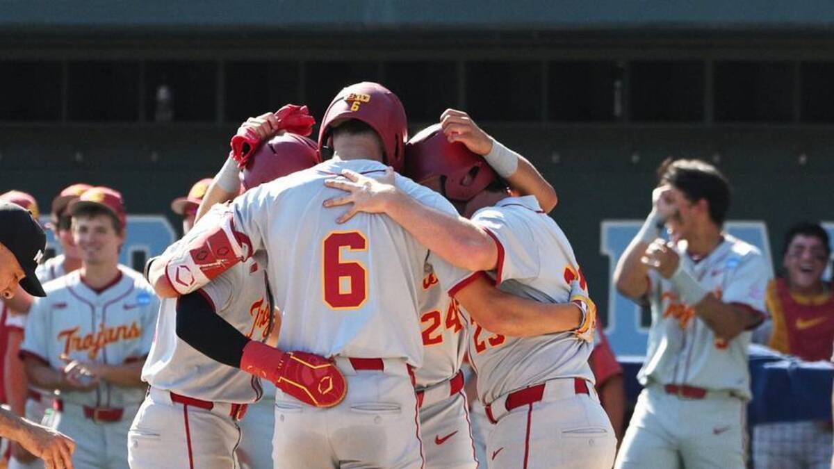  Jun 5, 2026; Chapel Hill, NC, USA; The USC Trojans celebrate a grand slam by USC infielder Dean Carpentier (6) against the North Carolina Tar Heels in the sixth inning at Boshamer Stadium. Mandatory Credit: Zachary Taft-Imagn Images | Zachary Taft-Imagn Images 