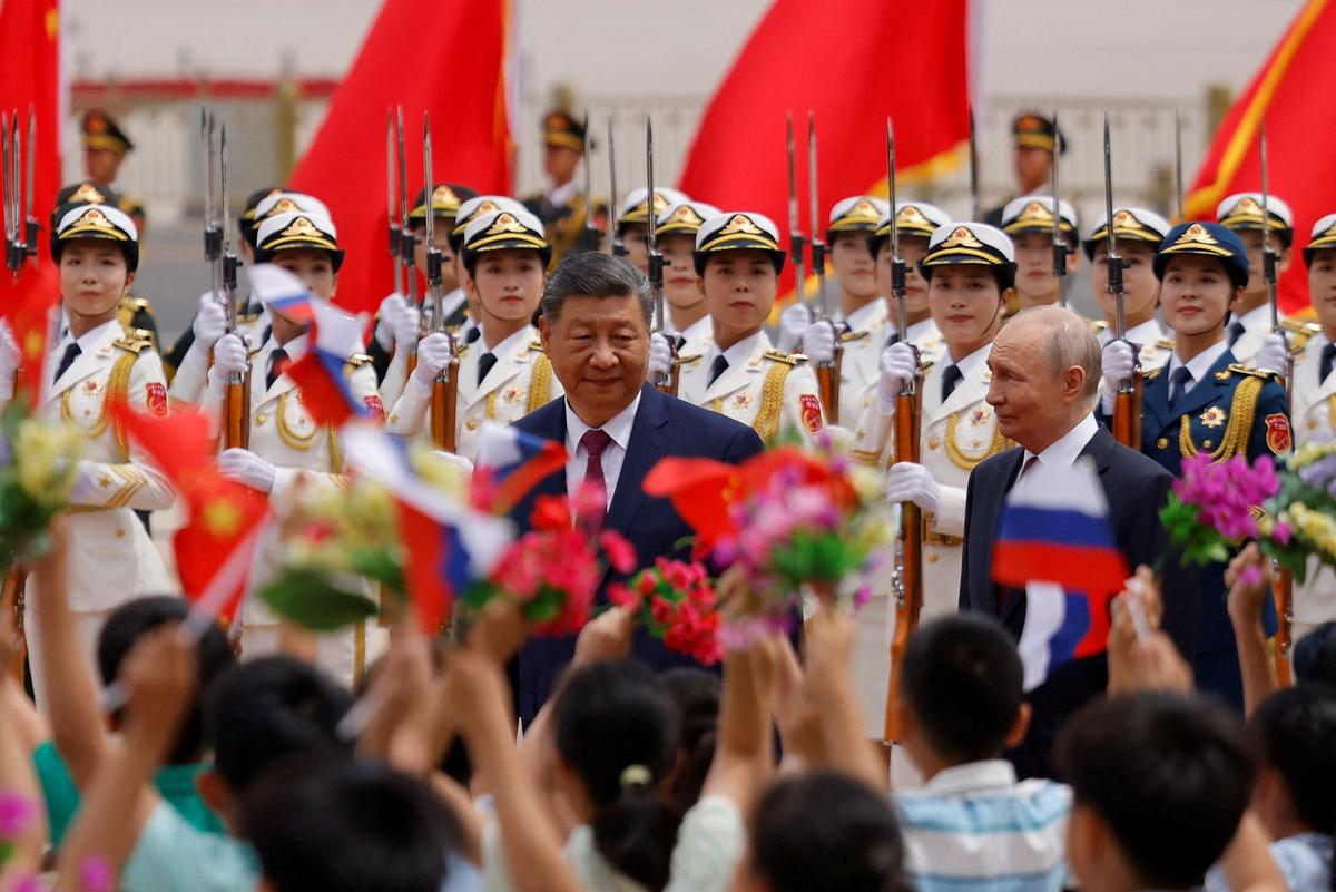 Russian President Vladimir Putin and Chinese President Xi Jinping attend a welcoming ceremony at the Great Hall of the People in Beijing, China May 20, 2026. REUTERS/Maxim Shemetov/Pool