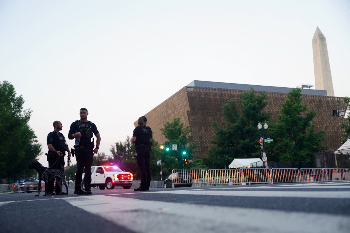 Members of the U.S. Secret Service guard a security checkpoint near the Washington Monument ahead of Fourth of July celebrations, marking the 250th anniversary of U.S. Independence, in Washington, D.C., U.S., July 4, 2026. REUTERS/Nathan Howard