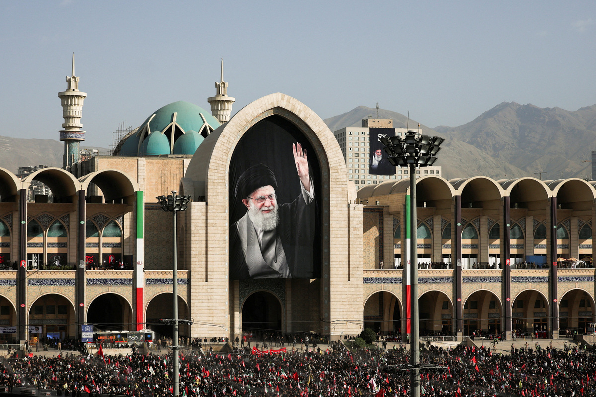 A banner with an image of late Supreme Leader Ayatollah Ali Khamenei is displayed as people gather on the day of a public farewell ceremony to pay their respects to Khamenei, who was killed on February 28 in Israeli and U.S. airstrikes, at the Imam Khomeini Grand Mosalla, in Tehran, Iran July 4, 2026.  REUTERS/Mohammed Salem