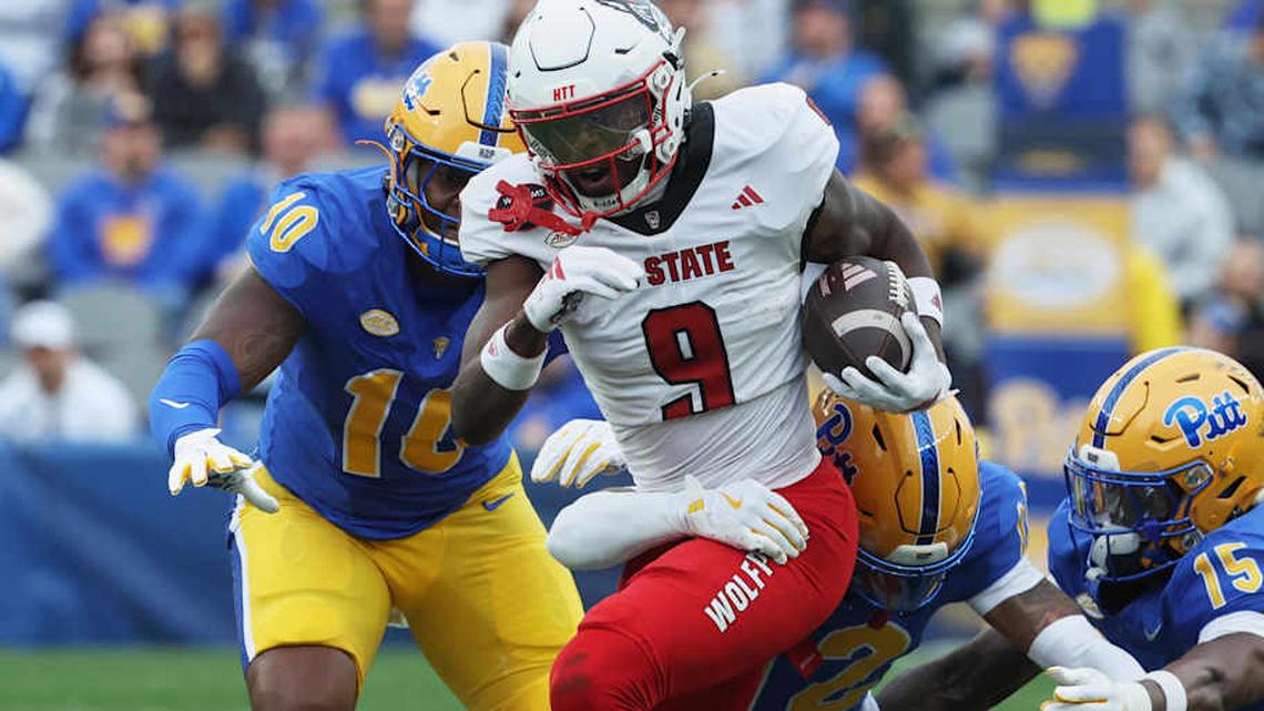  Oct 25, 2025; Pittsburgh, Pennsylvania, USA; North Carolina State Wolfpack wide receiver Terrell Anderson (9) runs with the ball after a catch against the Pittsburgh Panthers during the first quarter at Acrisure Stadium. Mandatory Credit: Charles LeClaire-Imagn Images | Charles LeClaire-Imagn Images 