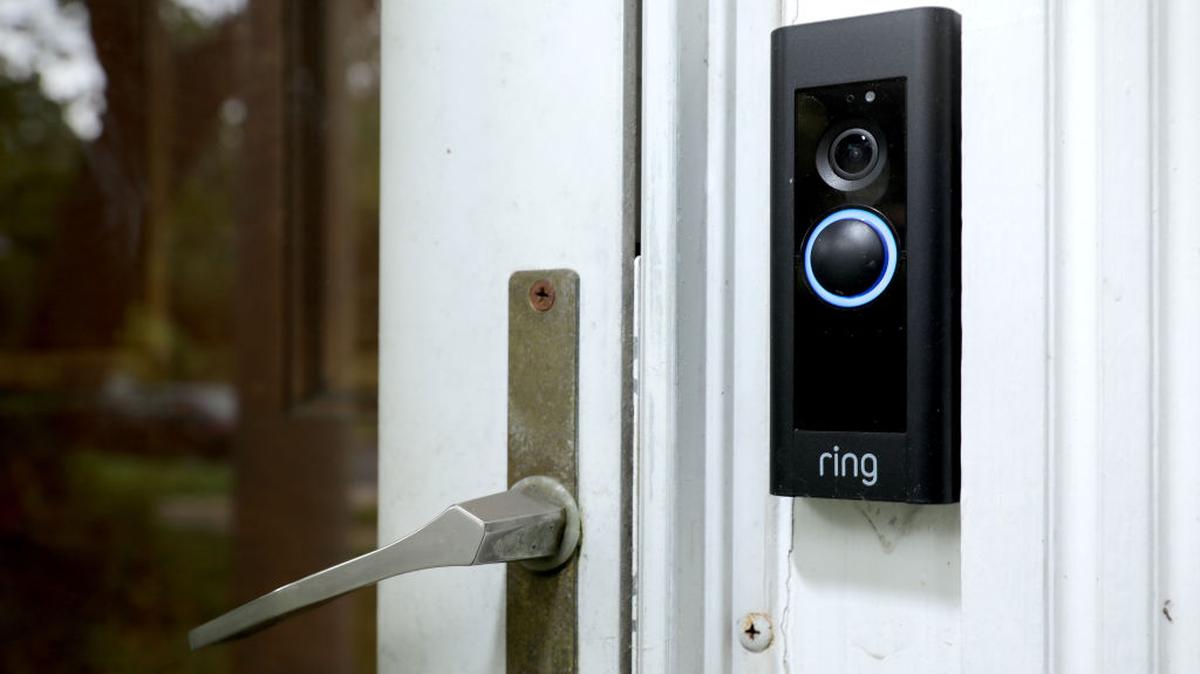A doorbell device with a built-in camera made by home security company Ring is seen in 2019 in Silver Spring, Maryland. 