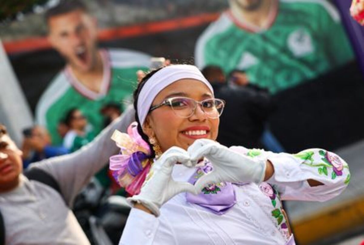 Soccer Football - FIFA World Cup 2026 - Group A - Mexico v South Africa - Estadio Azteca, Mexico City, Mexico - June 11, 2026 A fan poses for a photograph outside the stadium before the match REUTERS/Kai Pfaffenbach