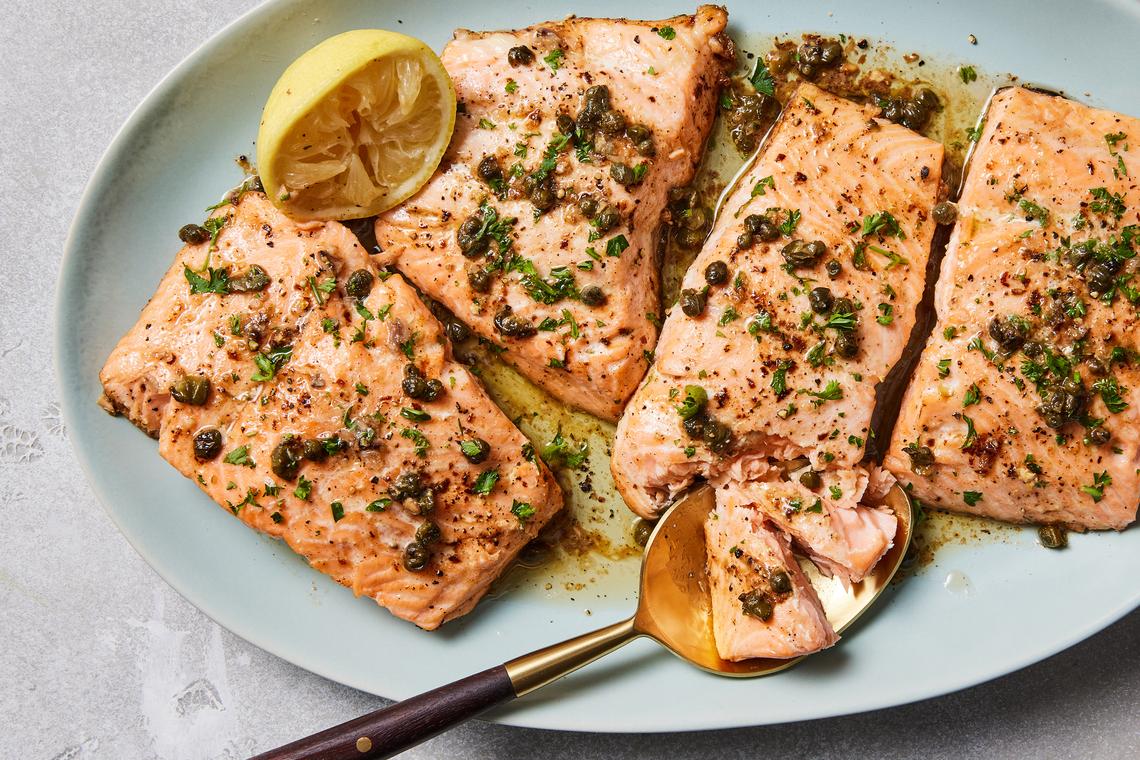 Salmon with anchovy garlic butter. The umami and flavor that the anchovies contribute simply make salmon taste like a deeper, more salmony salmon. Food styled by Spencer Richards. (Christopher Testani/The New York Times)