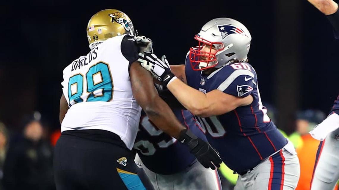  Jan 21, 2018; Foxborough, MA, USA; New England Patriots quarterback Tom Brady (12) throws a pass as center David Andrews (60) blocks Jacksonville Jaguars defensive tackle Marcell Dareus (99) during the AFC Championship at Gillette Stadium. Mandatory Credit: Mark J. Rebilas-Imagn Images | Mark J. Rebilas-Imagn Images 