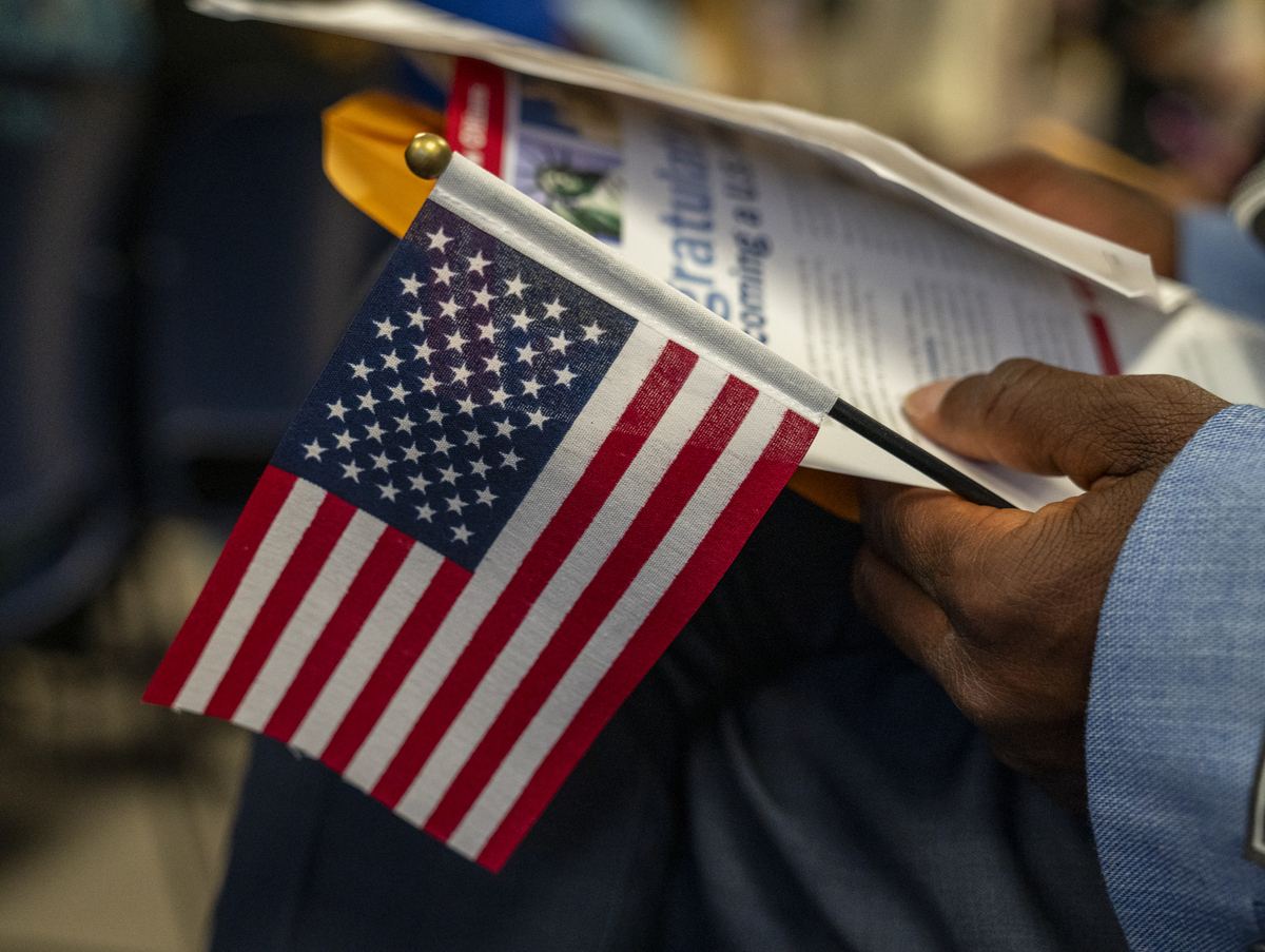  Candidates for U.S. citizenship wait to receive certificates of naturalization during a formal ceremony on June 4, 2025, in New York City. 