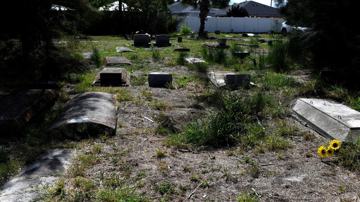 Graves at The Old Memphis Cemetery, a predominantly African-American cemetery, after the place was vandalized, with 17 gravesites and several headstones damaged in Palmetto, Florida, U.S., May 14, 2026. Authorities say “Trump” and “DeSantis” were spray-painted in red across several tombs as police continue investigating the incident. REUTERS/Octavio Jones