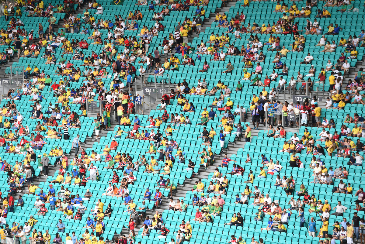  Football fans sit in the stands before a Group F football match between Bosnia-Herzegovina and Iran at the Fonte Nova Arena in Salvador during the 2014 FIFA World Cup in Brazil on June 25, 2014. 