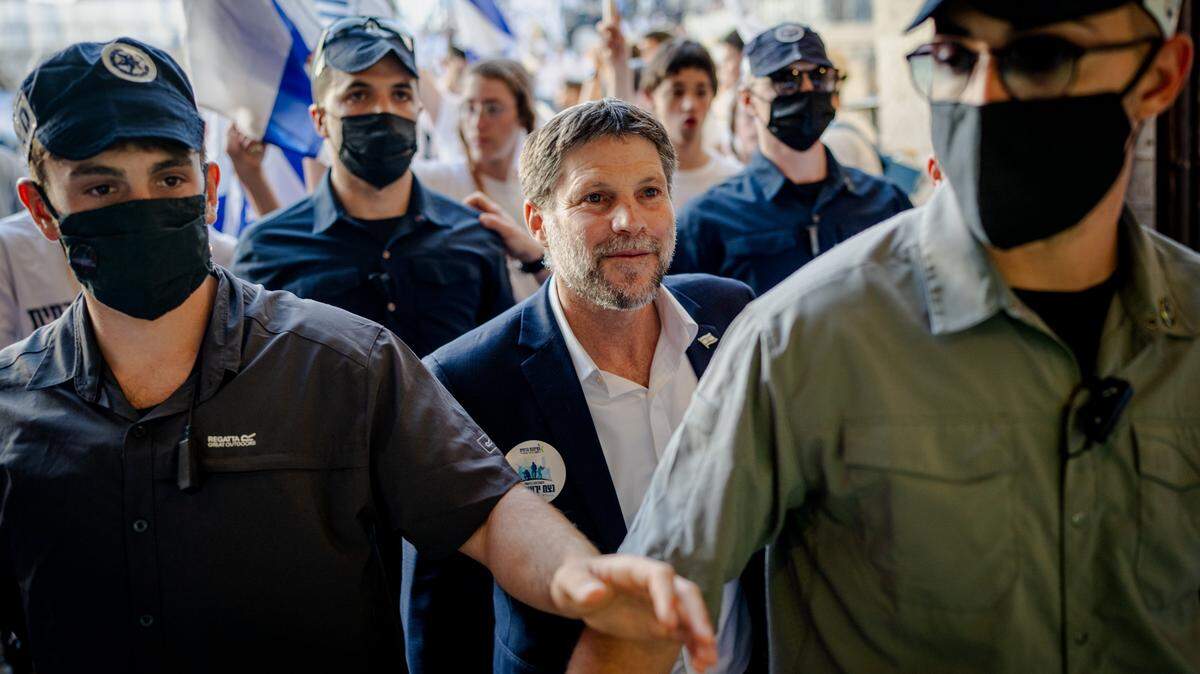 Israeli Finance Minister Bezalel Smotrich, center, takes part in the Jerusalem Day parade at the Damascus Gate on May 14 in the Old City of Jerusalem. Smotrich said on Tuesday that he had ordered the eviction of Palestinian residents of a West Bank hamlet after learning that the International Criminal Court prosecutor had requested a warrant for his arrest.