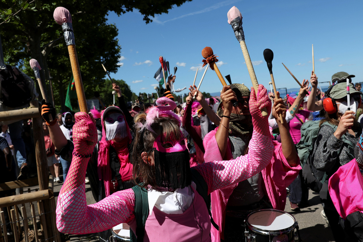 People hold a protest against the upcoming G7 summit in Evian-les-Bains in France, in Geneva, Switzerland, June 14, 2026. REUTERS/Umit Bektas