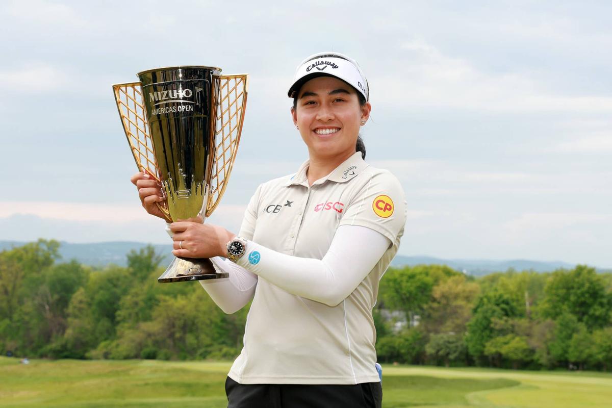  Jeeno Thitikul of Thailand poses with the trophy after her winning putt on the 18th green during the final round of the Mizuho Americas Open 2026 at Mountain Ridge Country Club on May 10, 2026, in West Caldwell, New Jersey. Photo by Sarah Stier/Getty Images