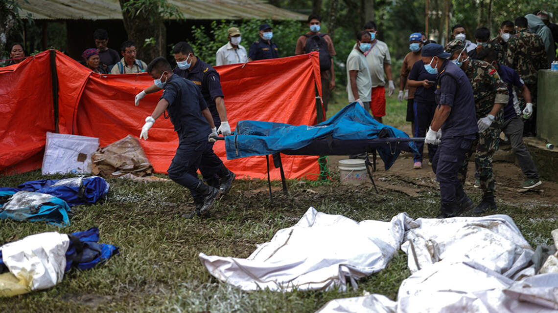 Rescuers battle floods and debris as Himalayan disaster death toll nears 800 