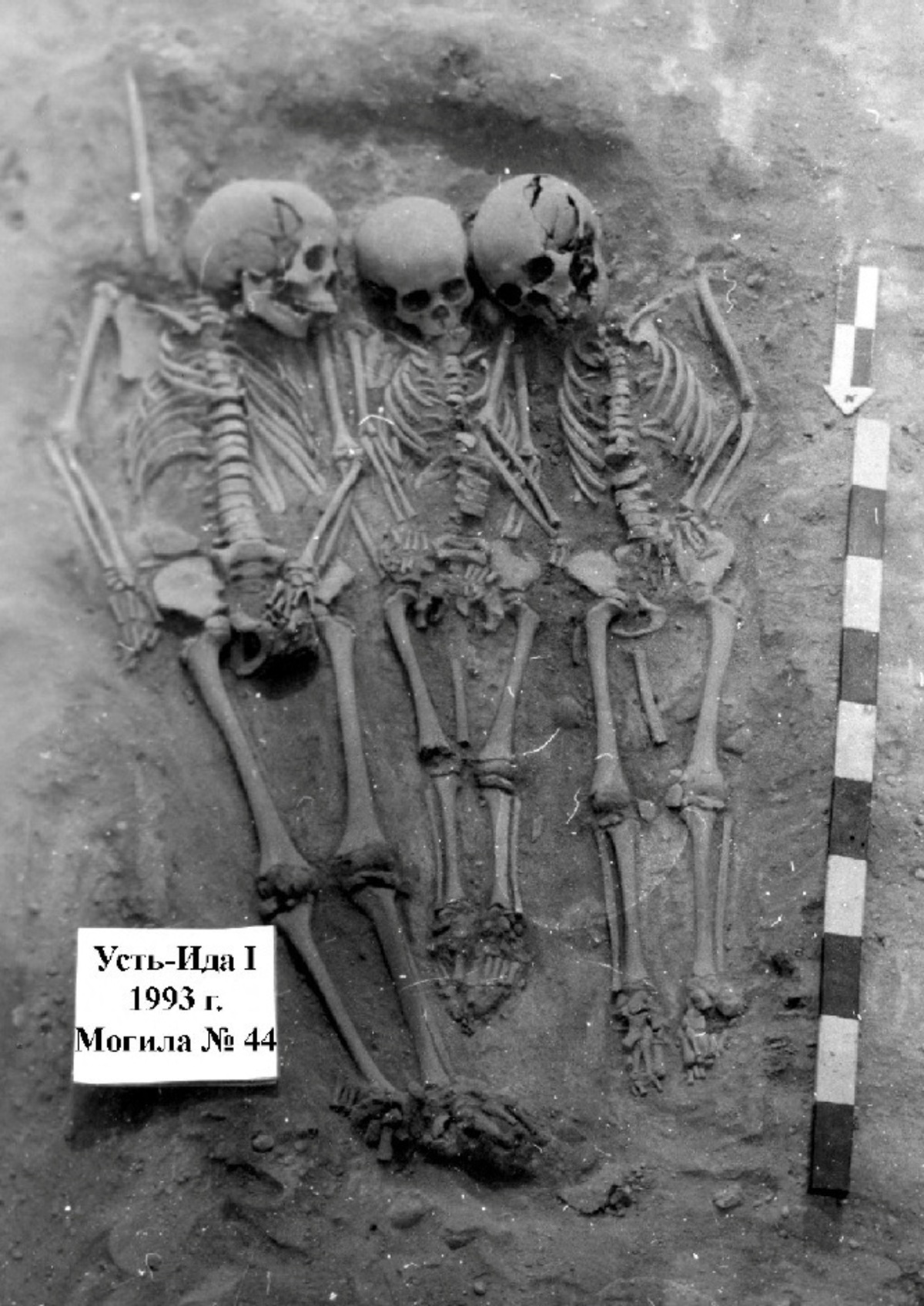 A grave excavated in the vicinity of Lake Baikal in Siberia bears the remains of three people from a community of hunter-gatherers who were buried roughly 5,500 years ago. Two of them were identified from ancient DNA as half-sisters, ages 9-10 years old and 5-6 years old, while the third was a boy around 11-12 years old, not closely related to the girls, who was found to have had plague DNA in his skeletal remains. The photograph, taken in 1993, was released on June 17, 2026. Vladimiri Bazaliiskii/Handout via REUTERS