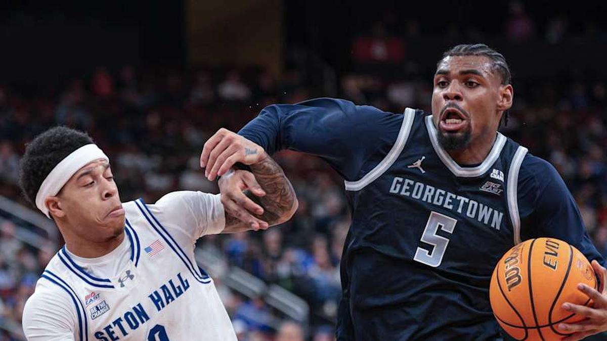  Feb 21, 2026; Newark, New Jersey, USA; Georgetown Hoyas guard KJ Lewis (5) drives to the basket against Seton Hall Pirates guard Adam Clark (0) during the first half at Prudential Center. | Vincent Carchietta-Imagn Images 