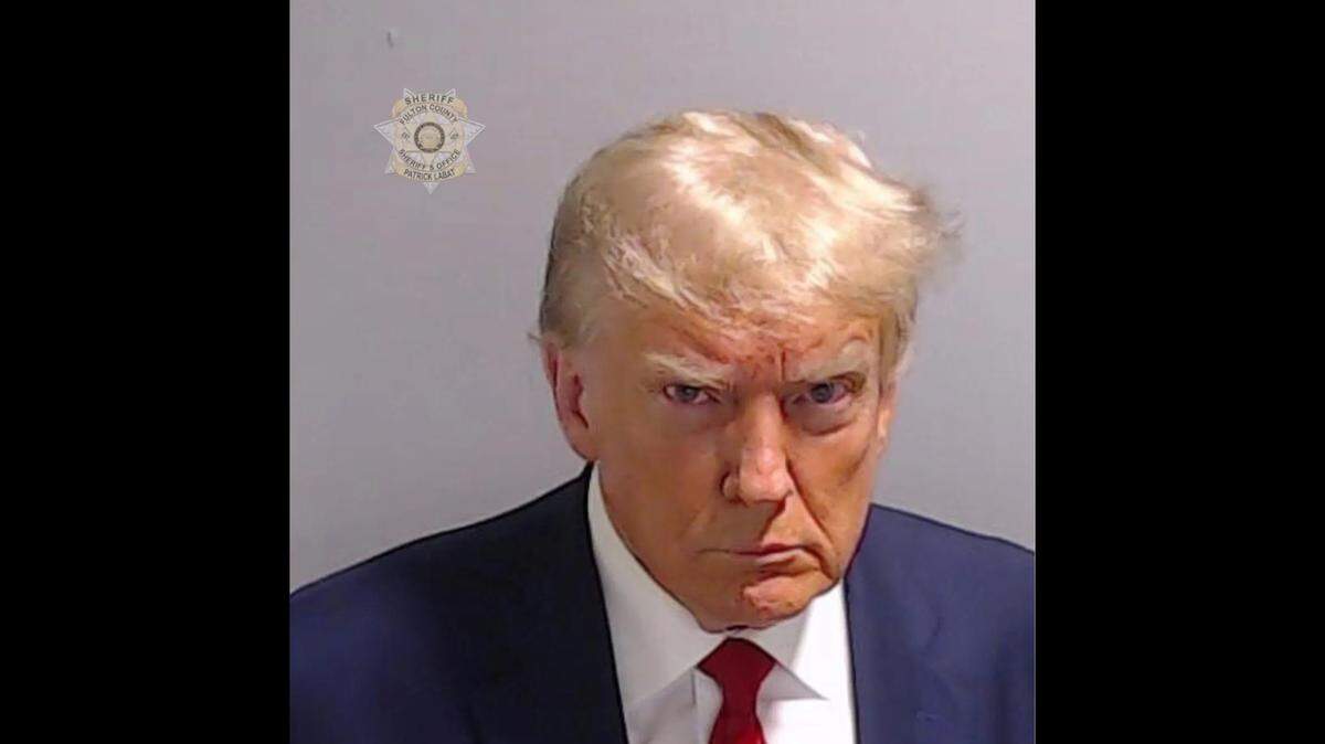 This handout booking photo provided by the Fulton County Sheriff’s Office shows Donald Trump after he surrendered and was booked. Former President Donald Trump, and 18 others were indicted on 41 charges related to their efforts to overturn the 2020 US Presidential election.