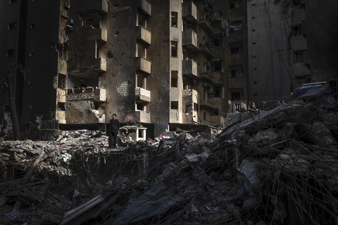 A man stands on the ruins of an apartment building as he surveys the destruction to the neighborhood near the Corniche, the seaside promenade, in Beirut, Lebanon, on Monday, April 13, 2026. According to the Lebanese government, more than 2,000 people have been killed in the country since the Iran-backed militia Hezbollah fired on northern Israel in early March, prompting a widening Israeli ground invasion. (Diego Ibarra Sánchez/The New York Times)