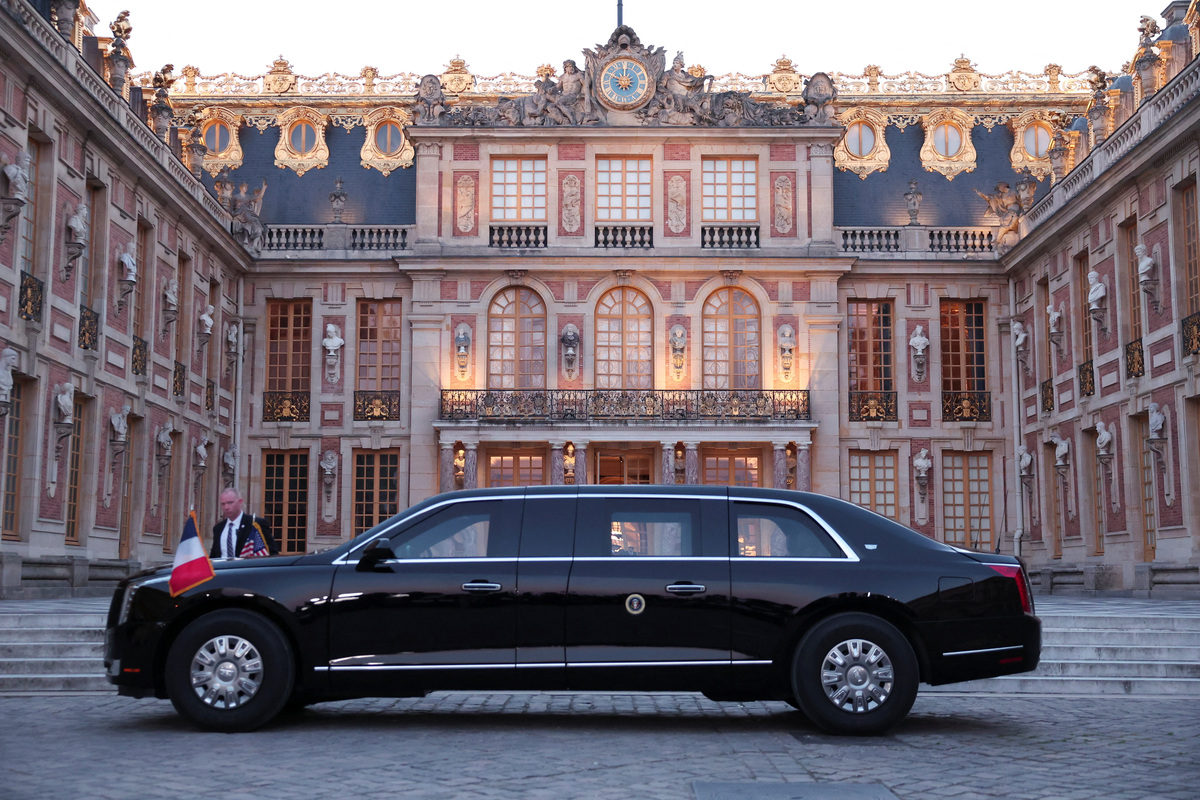 A car from the motorcade of U.S. President Donald Trump parks at the Palace of Versailles as he attends a dinner hosted by French President Emmanuel Macron and Brigitte Macron to mark the 250th anniversary of the United States’ independence, near Paris, France, June 17, 2026. REUTERS/Gonzalo Fuentes