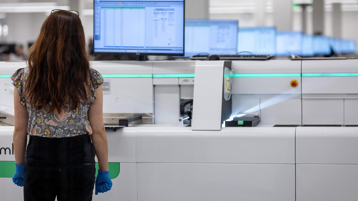 A worker watches a machine process ballots at a Los Angeles County Ballot Processing Center on June 8, 2026, in City of Industry, California, as counting continues on ballots cast for the state's primary election held June 2. (Eric Thayer/Los Angeles Times/TNS)